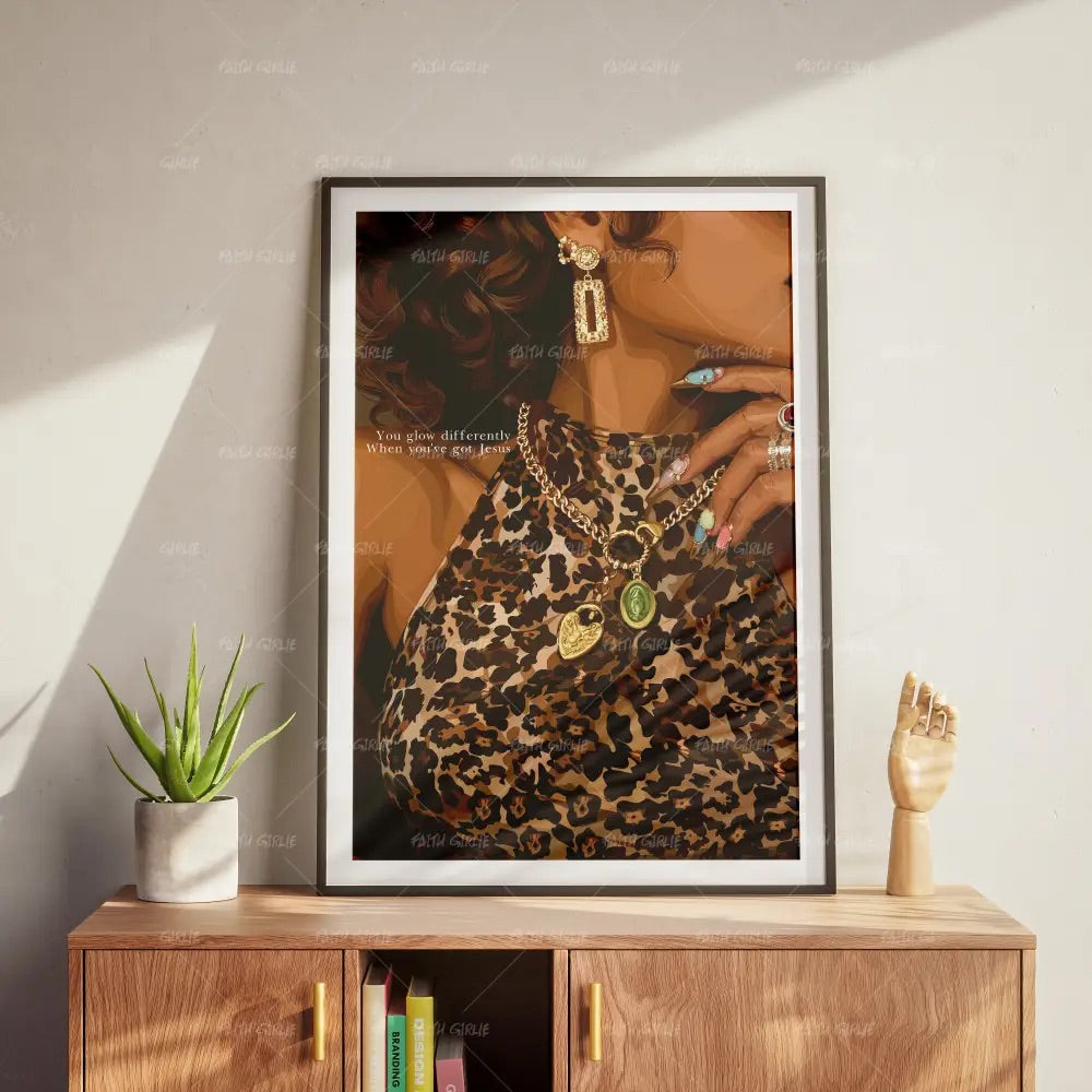 Glowdifferently Christian confidence wall art by Faith Girlie featuring a stylish woman in leopard print with gold jewelry and the message “You glow differently when you've got Jesus.”